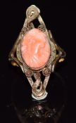A 14k gold ring set with a coral cameo and filigree decoration, 4.8g, size Q/R