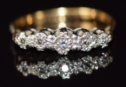 An 18ct gold ring set with diamonds in a platinum setting, 2.8g, size L