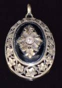 A 14ct gold pendant set with a diamond and onyx with ivy decoration, 3 x 2.2cm, 5.5g
