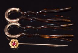A 9ct gold stick pin set with a ruby (2.2g) and tortoiseshell hair pins mounted with 9ct gold