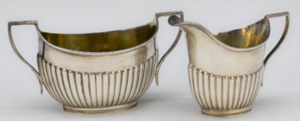 George V hallmarked silver sugar bowl and milk jug with reeded decoration, Sheffield 1920, maker