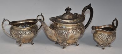 Edward VII hallmarked silver three piece bachelor's teaset with embossed decoration, raised on