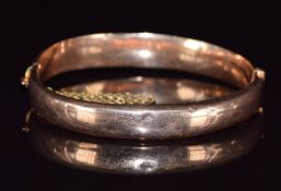 A 9ct rose gold bangle, Birmingham 1917, 10.2g, 5.5 x 5.3cm
