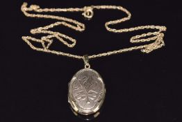 A 9ct gold locket (2 x 2.5cm) on a 9ct gold chain, 44cm, 6g
