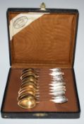 Two sets of six German silver teaspoons, one with an extra spoon, both marked 800, in fitted case by