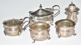 Hallmarked silver cruet items comprising Mappin & Webb mustard, further mustard (both with blue