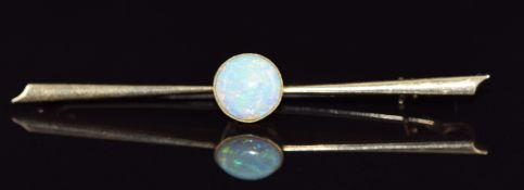 A 15ct gold brooch set with an opal cabochon, 4g, 6cm long