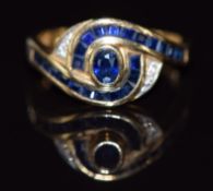 A 14k gold ring set with sapphires and diamonds in a twist setting, 3.4g, size M