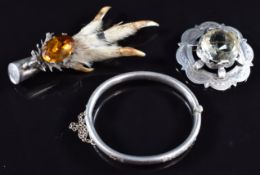 Scottish silver brooch by WBs, silver christening bangle and silver mounted rabbit's foot
