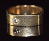 A 9ct gold ring set with a diamond, 8.1g, size R