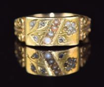 A c1920 15ct gold ring set with seed pearls and diamonds in a floral design, 2.3g, size J