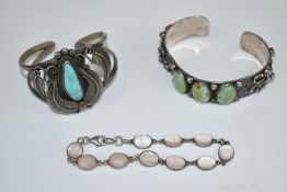 Two silver Navajo bangles set with turquoise and a moonstone bracelet