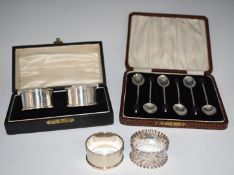 Cased pair of hallmarked silver napkin rings, two further hallmarked silver napkin rings and a cased
