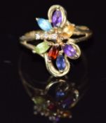 A 9ct gold ring set with amethyst, peridot, tanzanite, citrine, topaz and diamonds, 2.9g, size M/N
