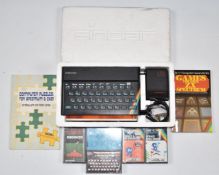Sinclair ZX Spectrum games console in original packaging together with five games and two related