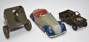Three tinplate toys comprising an Arnold or similar clockwork open topped sports car marked '
