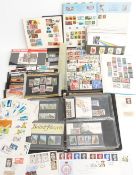 Mint and used mostly GB stamps and first day covers in two albums and loose, including