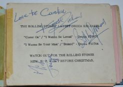 A 1960s autograph book containing a 1964 Rolling Stones promotional card signed by Mick Jagger,