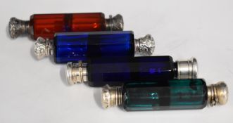 Four coloured cut glass double ended scent bottles, all with unmarked silver caps, length of longest