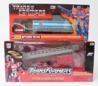 Two Hasbro Transformers sets Optimus Prime Fire Truck 2001 and Commemorative Series G1 Optimus Prime
