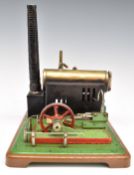 A stationary live steam engine with fixed cylinder, whistle and sight glass