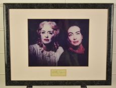 Bette Davis clipped signature, framed with a photograph of Davis, with 'The Autograph Gallery'