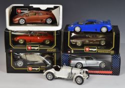 Seven mainly Burago 1:18 scale diecast model vehicles including Jaguar E Coupé, Ferrari F40, Bugatti