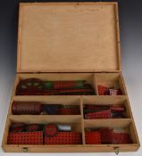 A collection of loose Meccano parts in fitted wooden dealer's box.