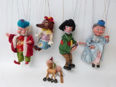 Four Pelham Puppets King SL22, Dachshund, Giant SL19 and Queen, in Pelham boxes.