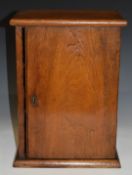 Oak collector's cabinet opening to reveal eight drawers, W28 x D19 x H38cm