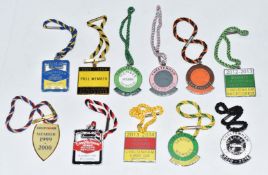 A collection of enamel and similar Cheltenham races member badges, c1999-2016