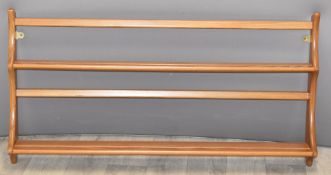 Ercol light elm wall mounted plate rack, width 94cm