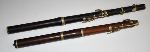 H Y Potter and Co, London 19thC rosewood flute together with a further wooden flute for restoration