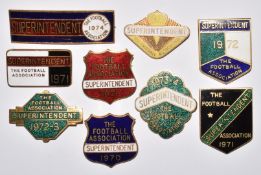 Seven The Football Association enamel Superintendent badges comprising 1970, three 1971, 1972,