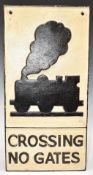 Cast iron 'crossing no gates' road sign, with steam locomotive above, 58 x 29cm