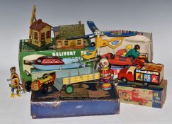 Fifteen mainly tinplate and pressed steel toys including Lionel railway buildings, Schuco Studio