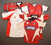 Five Gloucester Rugby related rugby shirts comprising two for Terry Fanolua, one signed the other
