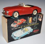 Schuco Elektro Phanomenal battery operated tinplate model of a Mercedes saloon, with red body, cream
