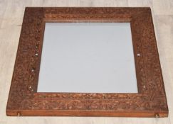 Anglo-Indian mirror with carved and pierced hardwood frame, 70 x 62cm
