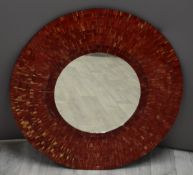 A circular designer mirror with mosaic surround, diameter 80cm
