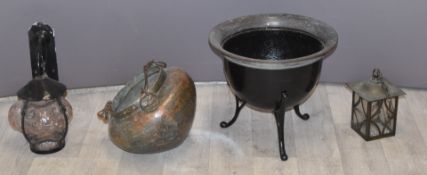 Eastern copper bowl, two outdoor lamps and a metal jardinière, diameter of largest 36cm