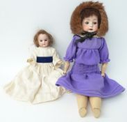 Two German bisque headed dolls Armand Marseille with weighted brown eyes, open mouth and jointed
