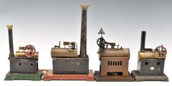 Four overtype stationary live steam engines, comprising one by Doll dated 1927 with governor, Ernest