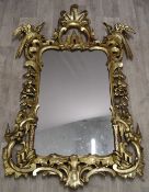 19thC gilt framed mirror with bird decoration, W 85 x H130cm