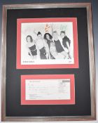 Spice Girls autographed promotional photograph, signed by all band members, framed together with a