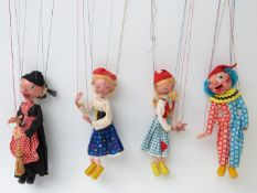 Four Pelham Puppets Witch SM, Mitzi SS8, Dutch Girl SS2 and Clown SM, all in original display boxes.