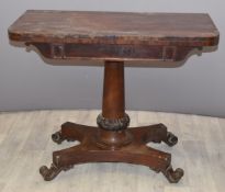 19thC mahogany fold over card table raised on a tapering column, width 92cm
