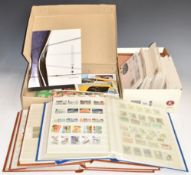 A mostly modern mint GB stamp collection in four stockbooks and two boxes, some first day covers