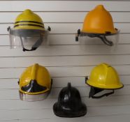 Five various modern Fire Service helmets comprising Cromwell Helmets Ltd example dated 1973,