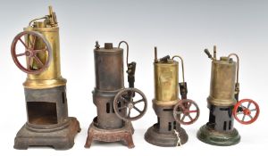 Four vertical live steam engines, two by Bing with oscillating cylinders, one with through